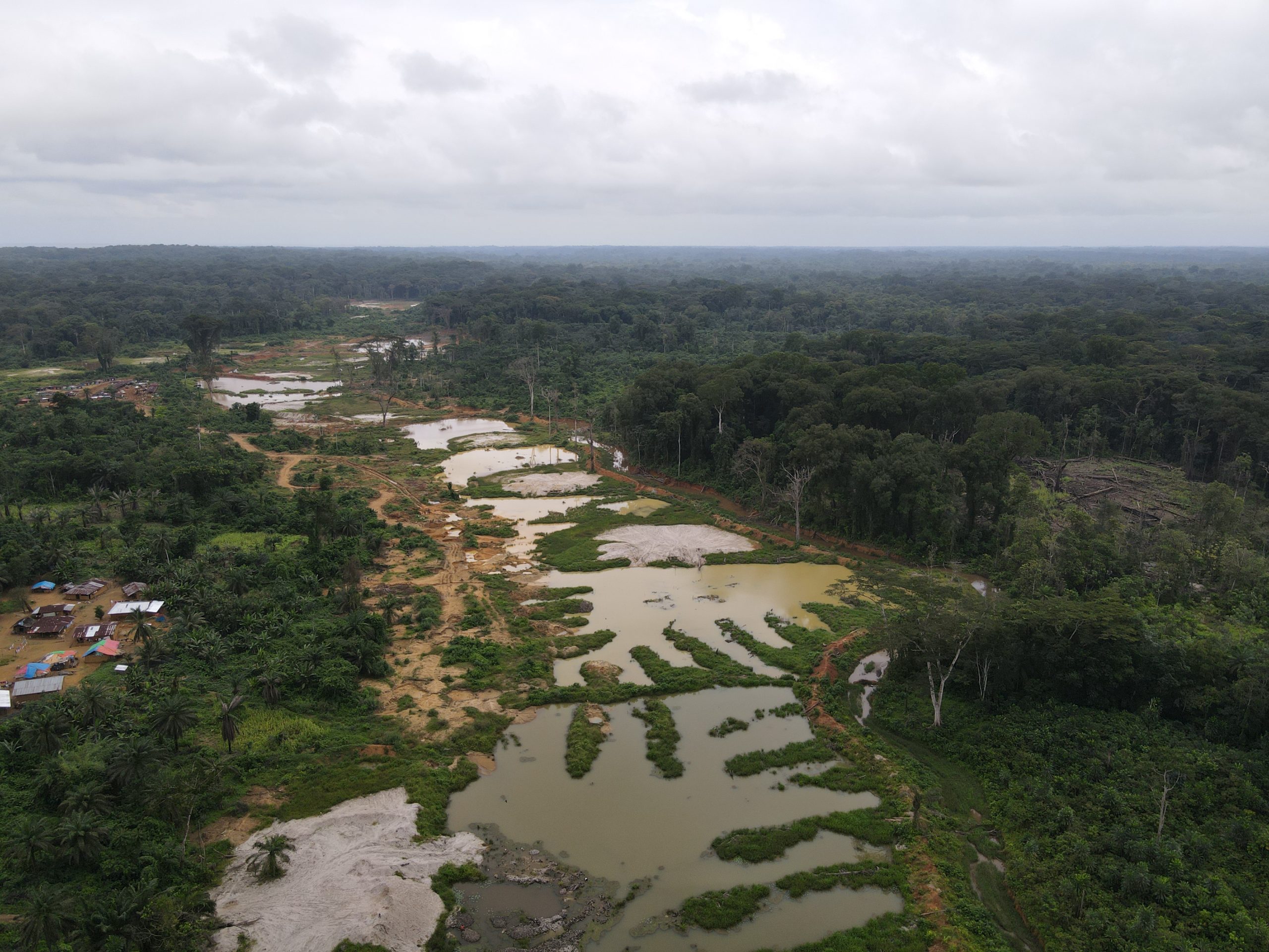 Drone shot of Deep Gold Incorporated mine in Gmarkemkpo, Sinoe The Deadly, Unlicensed Nigerian Gold Mine